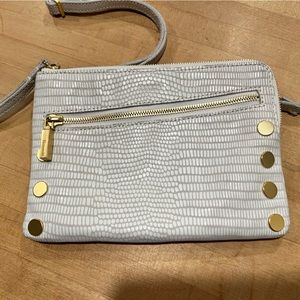 white leather convertible crossbody or clutch bag with red interior. EUC